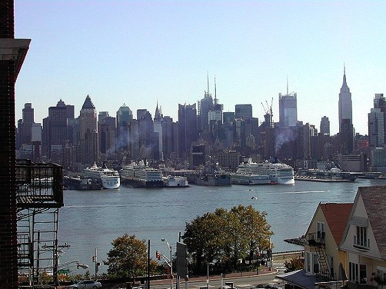 Three cruise ships and USS Nassau in port, NYC, from Weehawken, NJ